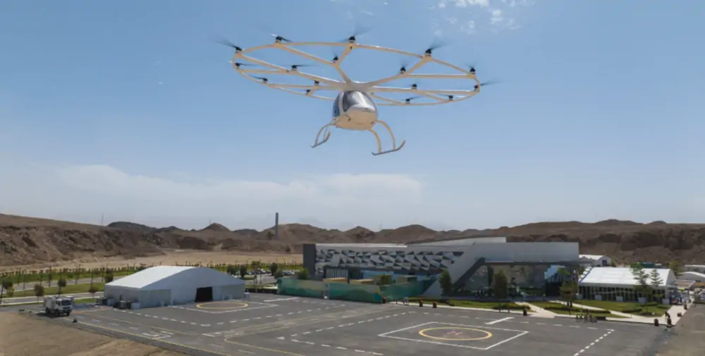 Volocopter lecący nad centrum doświadczalnym NEOM